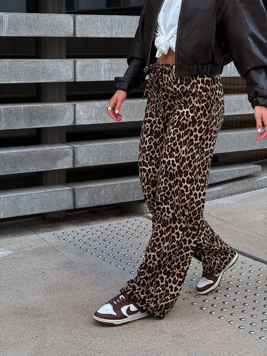 Leopardo rašto kelnės
